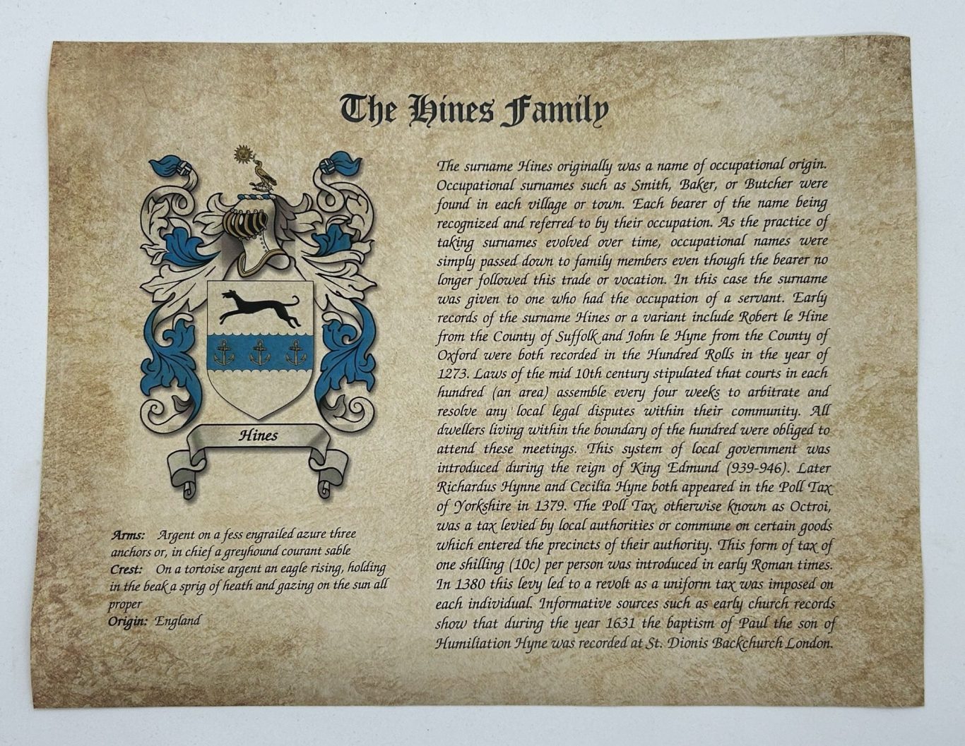 Coat of arms gift and family history on aged parchment paper.